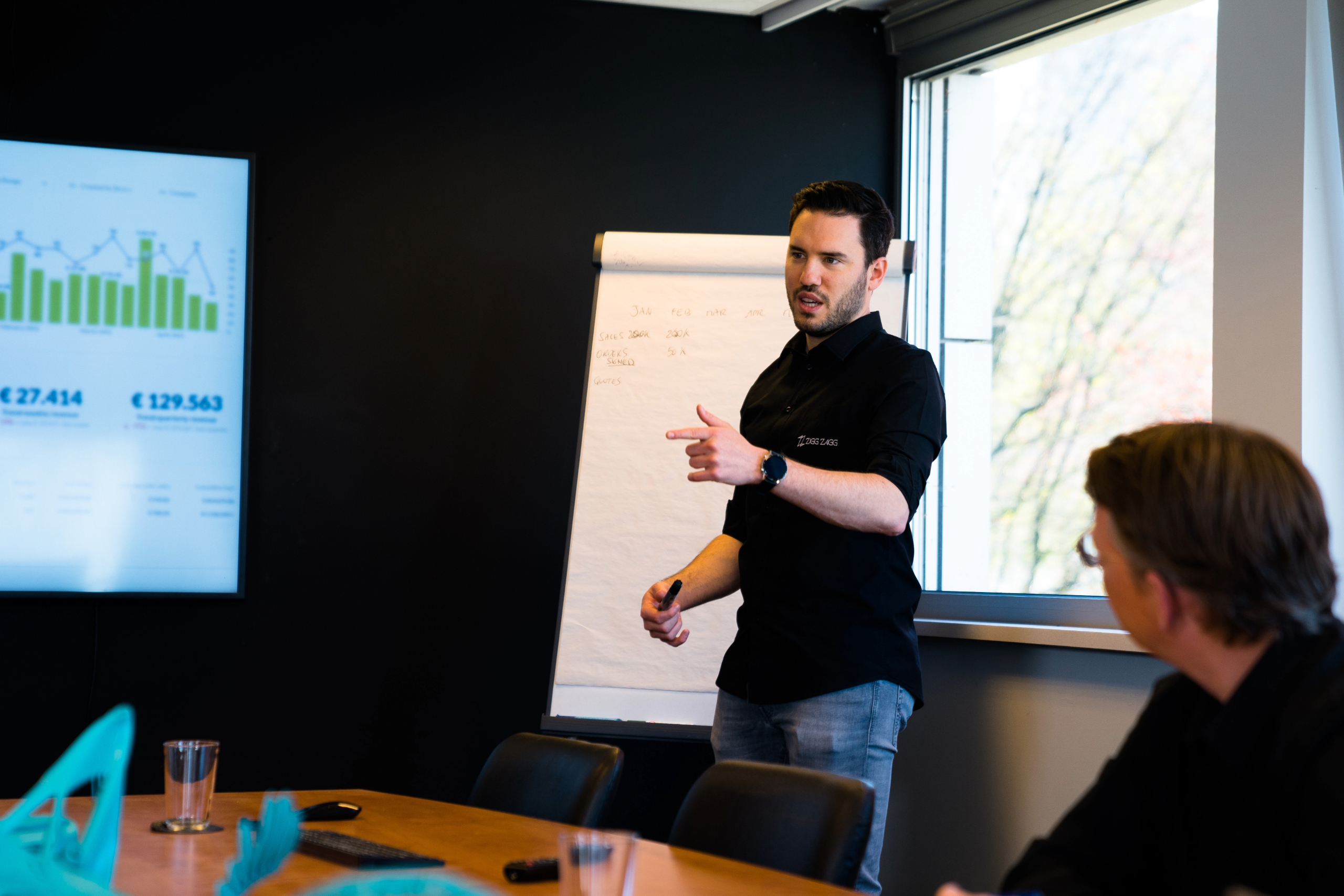 Professional 3D printing consultant demonstrating additive manufacturing techniques and explaining digital production processes to clients.